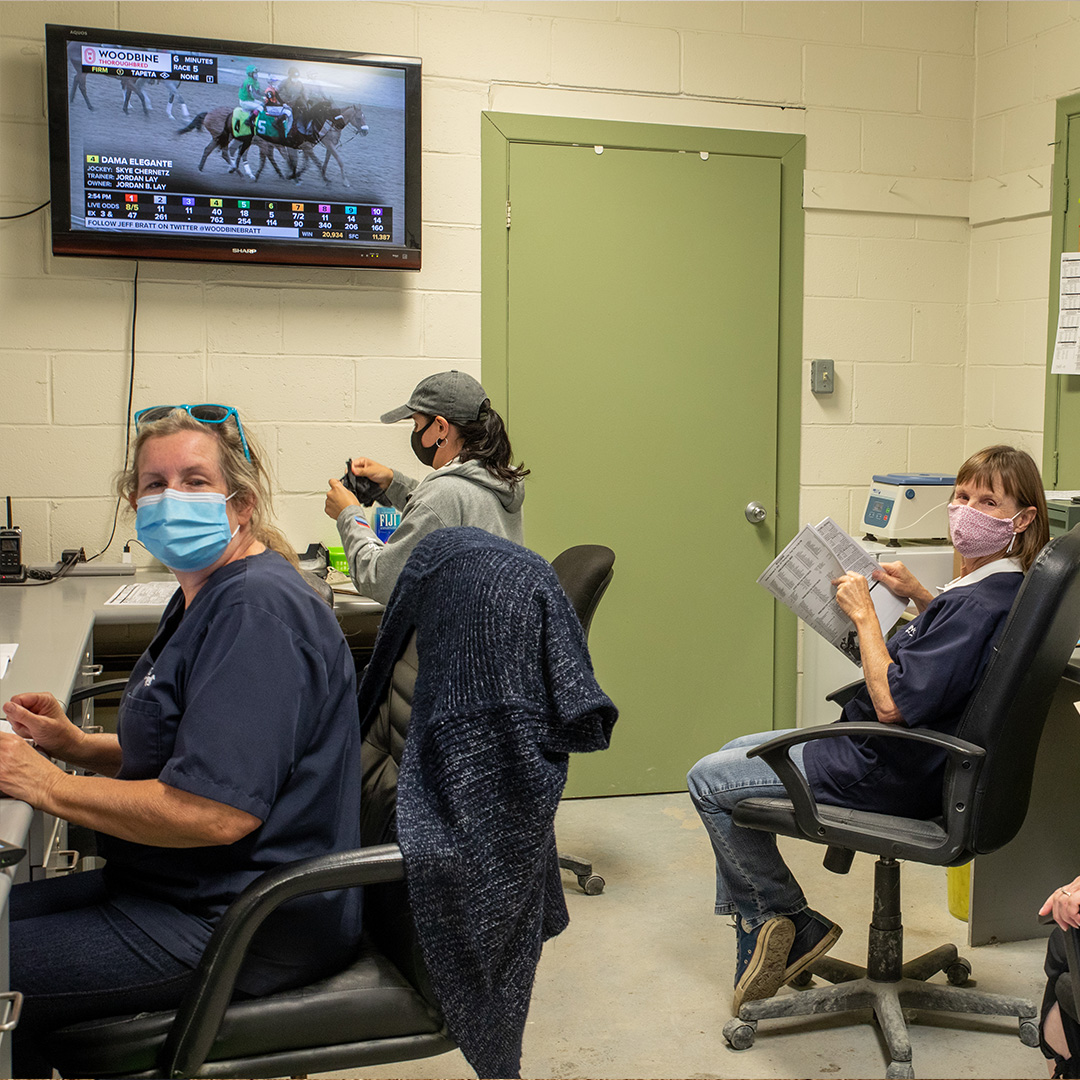 Racing Forensics personnel sitting in a retention area office